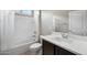 Bathroom showcasing a tub with shower, and a vanity with dark wood cabinets at 10743 W Bronco Trl, Peoria, AZ 85383