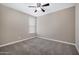 Bedroom featuring carpet flooring, neutral paint, and a window with blinds at 10743 W Bronco Trl, Peoria, AZ 85383