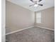 Neutral bedroom with carpet, ceiling fan and single window at 10743 W Bronco Trl, Peoria, AZ 85383