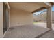 Covered patio with brick pavers, offering a shady retreat for outdoor enjoyment at 10743 W Bronco Trl, Peoria, AZ 85383