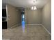 Dining room with neutral walls, chandelier, and tile floors, offering a bright and inviting space at 10743 W Bronco Trl, Peoria, AZ 85383