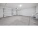 Large two car garage with ample space for parking and storage at 10743 W Bronco Trl, Peoria, AZ 85383