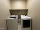 A clean laundry room with both a washer and a dryer for convenience at 10743 W Bronco Trl, Peoria, AZ 85383