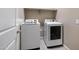 Well-equipped laundry room featuring modern, front-load washer and dryer units at 10743 W Bronco Trl, Peoria, AZ 85383