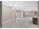 Large living room has lots of natural light and tile floors at 10743 W Bronco Trl, Peoria, AZ 85383