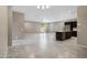 Open concept living room boasts lots of space and natural light and connects to the kitchen at 10743 W Bronco Trl, Peoria, AZ 85383