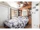 Cozy bedroom with built-in bookcase and a large window with natural light at 111 S Greenfield Rd # 119, Mesa, AZ 85206