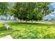 Grassy common area with mature trees and community facilities at 111 S Greenfield Rd # 119, Mesa, AZ 85206