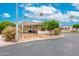 Charming home featuring covered parking, desert landscaping and mature trees at 111 S Greenfield Rd # 119, Mesa, AZ 85206