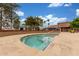 Inviting hot tub area with tiled accents, surrounded by mature landscaping and community buildings at 111 S Greenfield Rd # 119, Mesa, AZ 85206