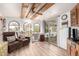 Cozy living room featuring wood-look floors and lots of natural light at 111 S Greenfield Rd # 119, Mesa, AZ 85206