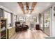 Cozy living room featuring wood-look floors and lots of natural light at 111 S Greenfield Rd # 119, Mesa, AZ 85206