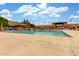 Community pool with ample seating, perfect for relaxing by the water at 111 S Greenfield Rd # 119, Mesa, AZ 85206