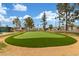 Enjoy the community putting green and manicured landscaping, perfect for relaxing on a sunny day at 111 S Greenfield Rd # 119, Mesa, AZ 85206
