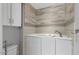 Modern bathroom featuring a built-in tub with decorative tile accents at 11342 E Laguna Azul Cir, Mesa, AZ 85209