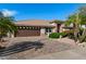 Charming single-story home featuring a tile roof, brick driveway, desert landscaping, and a two-car garage at 11342 E Laguna Azul Cir, Mesa, AZ 85209