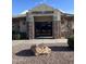 The community fitness center boasts a modern entrance with stone accents and a welcoming atmosphere at 11342 E Laguna Azul Cir, Mesa, AZ 85209