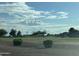 Expansive green space, beautiful blue sky, and puffy clouds make this neighborhood a pleasure to call home at 11342 E Laguna Azul Cir, Mesa, AZ 85209