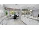 Bright eat-in kitchen features white cabinets, granite countertops, and stainless steel fixtures at 11342 E Laguna Azul Cir, Mesa, AZ 85209