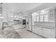 Bright kitchen featuring white cabinets, subway tile backsplash, granite countertops, and stainless steel appliances at 11342 E Laguna Azul Cir, Mesa, AZ 85209