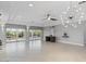 Expansive living area with recessed lighting, sliding glass doors, tile floors, and a stylish chandelier at 11342 E Laguna Azul Cir, Mesa, AZ 85209