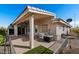 Covered patio features brick pavers, ceiling fans and a jacuzzi, perfect for outdoor enjoyment at 11342 E Laguna Azul Cir, Mesa, AZ 85209