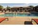 Community pool with ample lounge chairs and a well-maintained deck at 11342 E Laguna Azul Cir, Mesa, AZ 85209