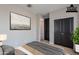This bedroom provides ample storage space, including large built-in closets and a calming neutral color palette at 11656 W Luxton Ln, Avondale, AZ 85323
