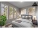 Bedroom featuring neutral walls and many windows that flood the space with natural light, creating a peaceful ambiance at 11656 W Luxton Ln, Avondale, AZ 85323