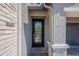 Inviting front door with a glass insert allowing natural light to brighten this home's interior and facade at 11656 W Luxton Ln, Avondale, AZ 85323