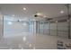Spacious three car garage with epoxy flooring and three garage doors at 11656 W Luxton Ln, Avondale, AZ 85323