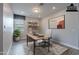 A stylish staged office features wood-look tile floors and neutral decor at 11656 W Luxton Ln, Avondale, AZ 85323