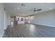 Open floor plan blending living room and modern white kitchen with island at 11656 W Luxton Ln, Avondale, AZ 85323