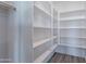 Walk-in pantry with multiple shelves at 11656 W Luxton Ln, Avondale, AZ 85323