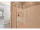 Glass enclosed shower features a showerhead and tile surround at 11656 W Luxton Ln, Avondale, AZ 85323
