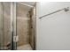 Tiled walk-in shower with glass door and neutral accents at 12228 S Pewaukee St, Phoenix, AZ 85044