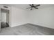 Neutral bedroom featuring carpet and a door to the on-suite bathroom at 12228 S Pewaukee St, Phoenix, AZ 85044