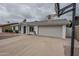 Charming single-story home with a well-maintained front yard and an attached two-car garage at 12228 S Pewaukee St, Phoenix, AZ 85044