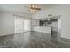 Spacious living room merging into the kitchen, with sliding doors leading to an outdoor space at 12228 S Pewaukee St, Phoenix, AZ 85044