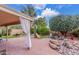 Backyard with desert landscaping, covered patio and brick pavers at 12686 N 95Th Way, Scottsdale, AZ 85260