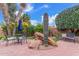 Backyard with desert landscaping featuring a cactus, rocks and patio furniture at 12686 N 95Th Way, Scottsdale, AZ 85260