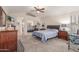 Large primary bedroom with vaulted ceilings, plush carpet, ceiling fan, and abundant natural light, creating a relaxing and private retreat at 12686 N 95Th Way, Scottsdale, AZ 85260