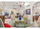 Open-concept dining area with vaulted ceilings, tile flooring, and a view into the adjacent living room, ideal for entertaining guests at 12686 N 95Th Way, Scottsdale, AZ 85260