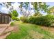 Spacious backyard featuring a lush lawn and privacy hedges at 131 N Higley Rd # 51, Mesa, AZ 85205