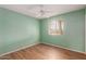 Room features laminate wood floors, ceiling fan, and window providing natural light at 131 N Higley Rd # 51, Mesa, AZ 85205