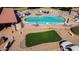 Aerial view of community pool, putting green and deck seating at 131 N Higley Rd # 51, Mesa, AZ 85205