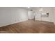 Open-concept living room with hardwood floors, fan, and access to the kitchen at 131 N Higley Rd # 51, Mesa, AZ 85205