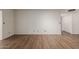 Bright living room with hardwood floors and closet doors at 131 N Higley Rd # 51, Mesa, AZ 85205