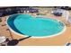 Resort-style community swimming pool and hot tub, surrounded by lounge chairs and a secure fence at 131 N Higley Rd # 51, Mesa, AZ 85205
