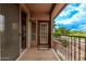 View from the balcony showing the exterior access door and sliding glass doors at 14250 W Wigwam Blvd # 722, Litchfield Park, AZ 85340